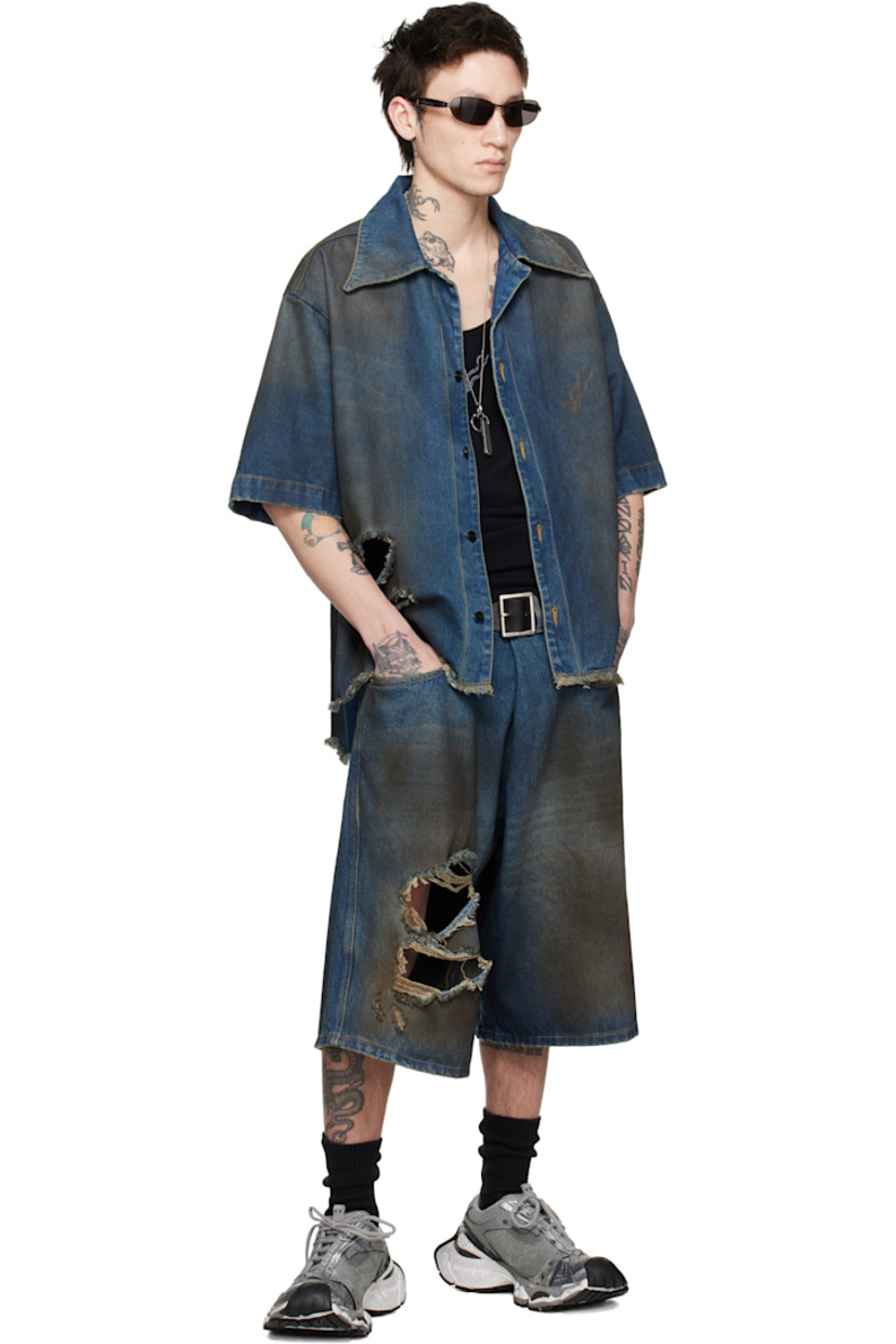 Non-stretch denim shorts. Smudging and fading throughout.

· Belt loops
· Five-pocket styling
· Zip-fly
· Rips at front
· Leather logo patch at back waistband
· Logo-engraved silver-tone hardware
· Contrast stitching in beige

Supplier color: Dirty blue