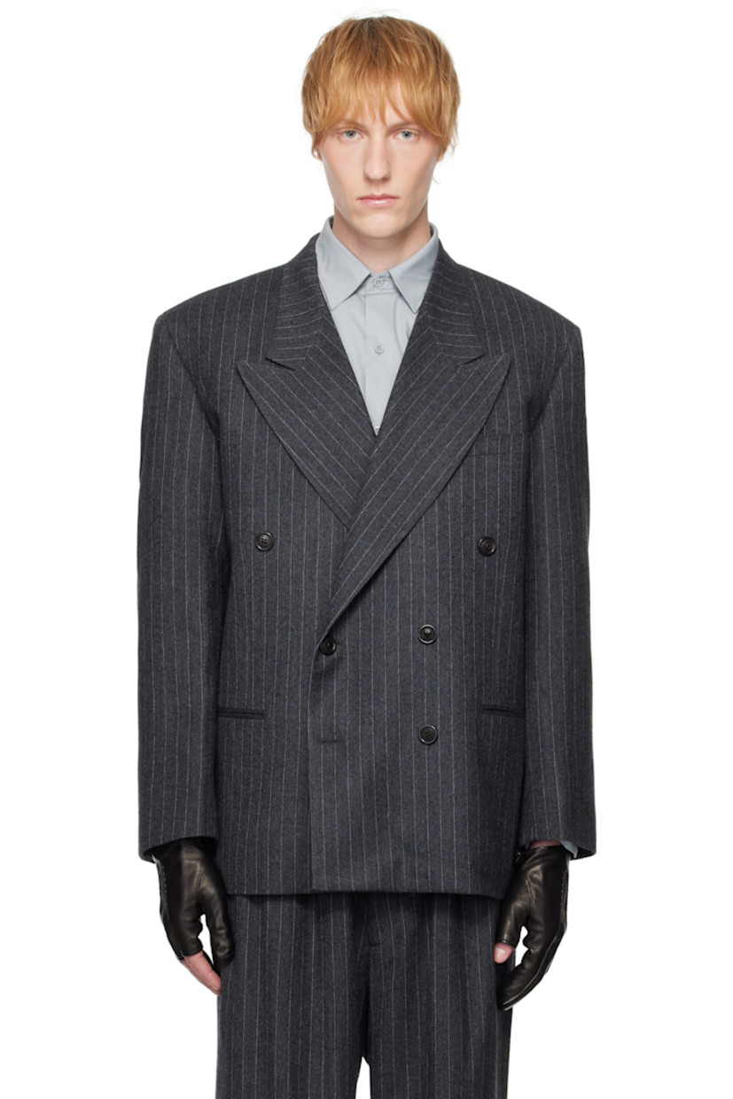 Virgin wool-blend twill blazer. Pinstripes throughout. 

· Peaked lapel
· Double-breasted button closure 
· Welt pockets at front 
· Surgeon's cuffs
· Graphic appliqué embroidered at back
· Welt pocket at interior  
· Full satin and plain-woven lining

Supplier color: Dark grey pinstripe