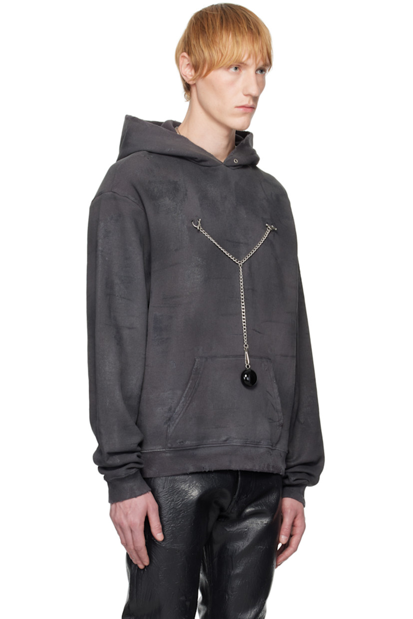 Waxed cotton fleece hoodie. Fading and distressing throughout. 

· Grommets at hood
· O-rings at chest
· Detachable curb chain with charm 
· Kangaroo pocket
· Rib-knit hem and cuffs
· Dropped shoulders
· Logo embroidered at back collar
· Silver-tone and black hardware 

Supplier color: Charcoal