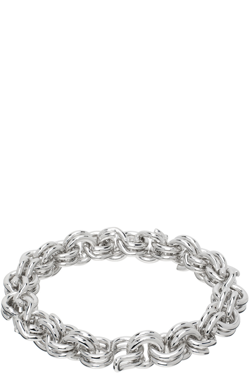 Rolo chain bracelet in sterling silver. 

· Hook-eye fastening 
· Full British hallmarking 
· L7.5"

Supplier color: 925 sterling silver