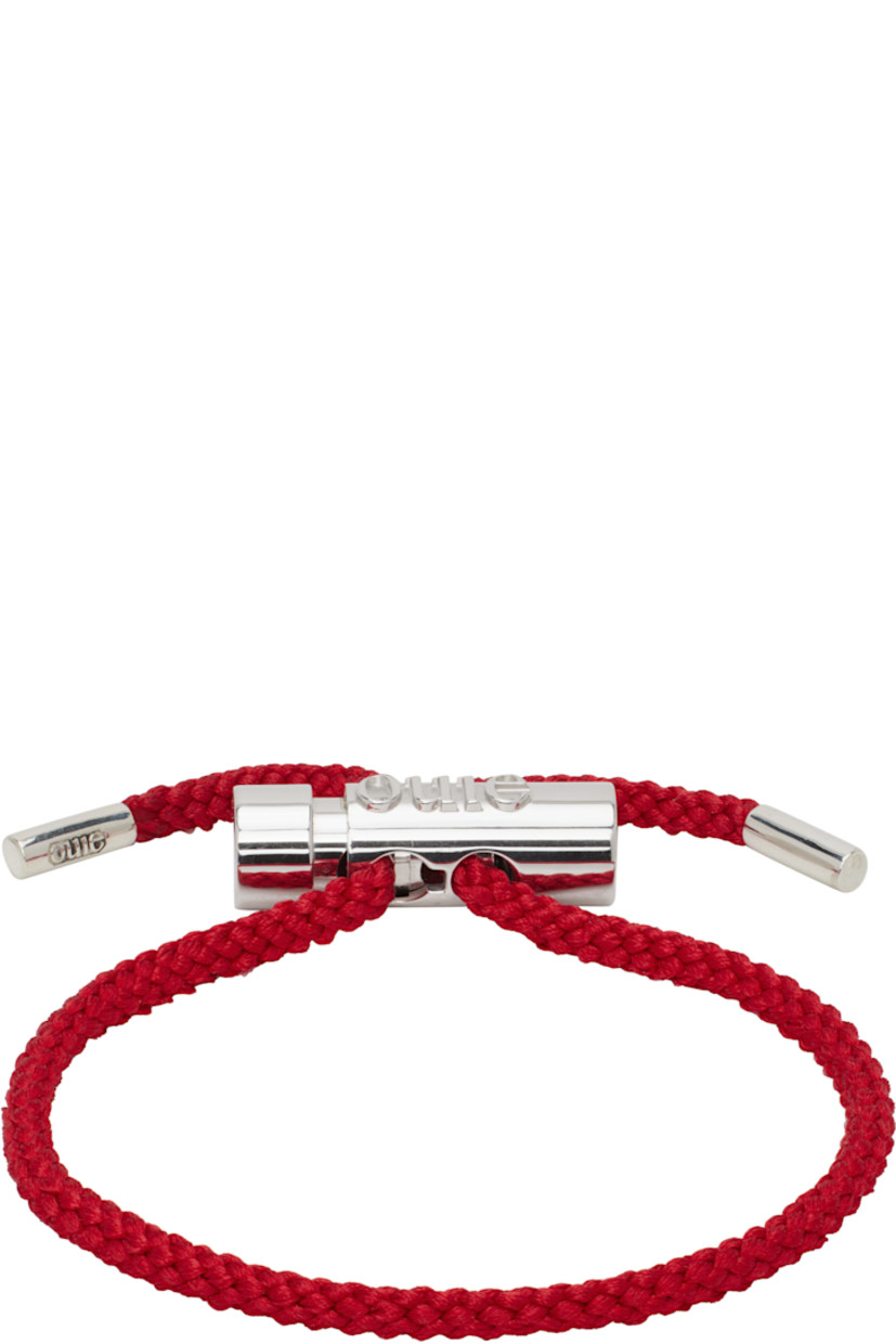 Braided cord bracelet in red. 

· Logo-engraved cord-lock toggle fastening 
· Full British hallmarking 
· Sterling silver hardware
· D5"

Supplier color: Red silver