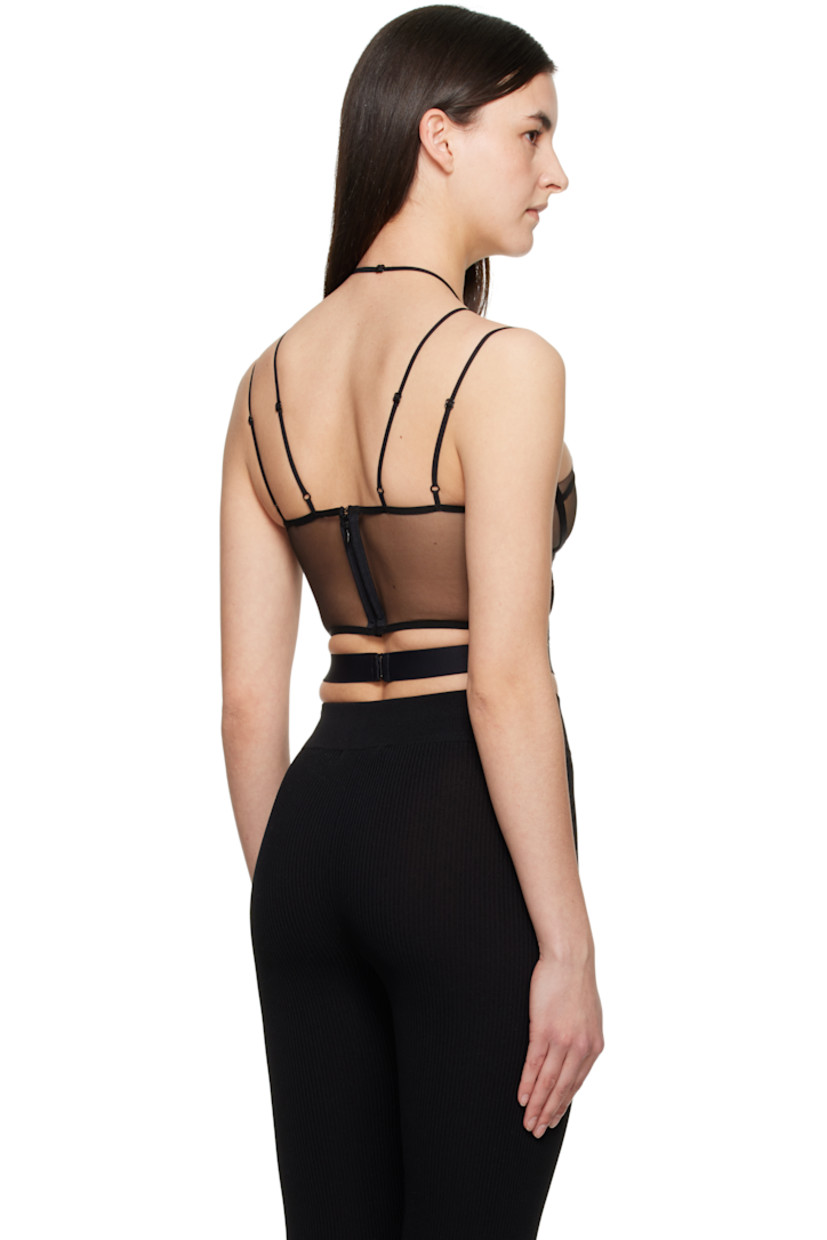 Sheer nylon tulle corset. Boning throughout.

· Adjustable halter straps
· Sweetheart neck
· Padding at cups
· Adjustable spaghetti straps
· Zip closure and hook-eye fastening at back

Supplier color: Black/Nude