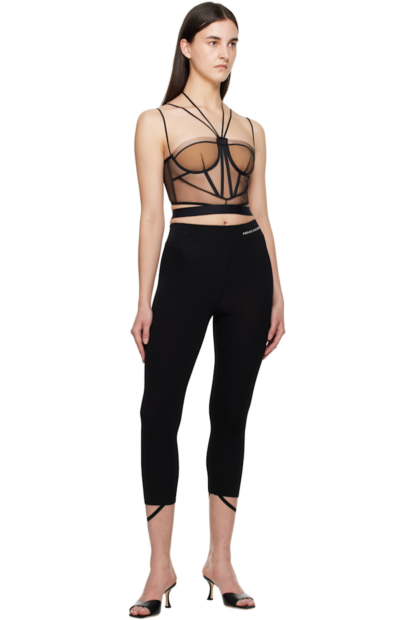 Sheer nylon tulle corset. Boning throughout.

· Adjustable halter straps
· Sweetheart neck
· Padding at cups
· Adjustable spaghetti straps
· Zip closure and hook-eye fastening at back

Supplier color: Black/Nude