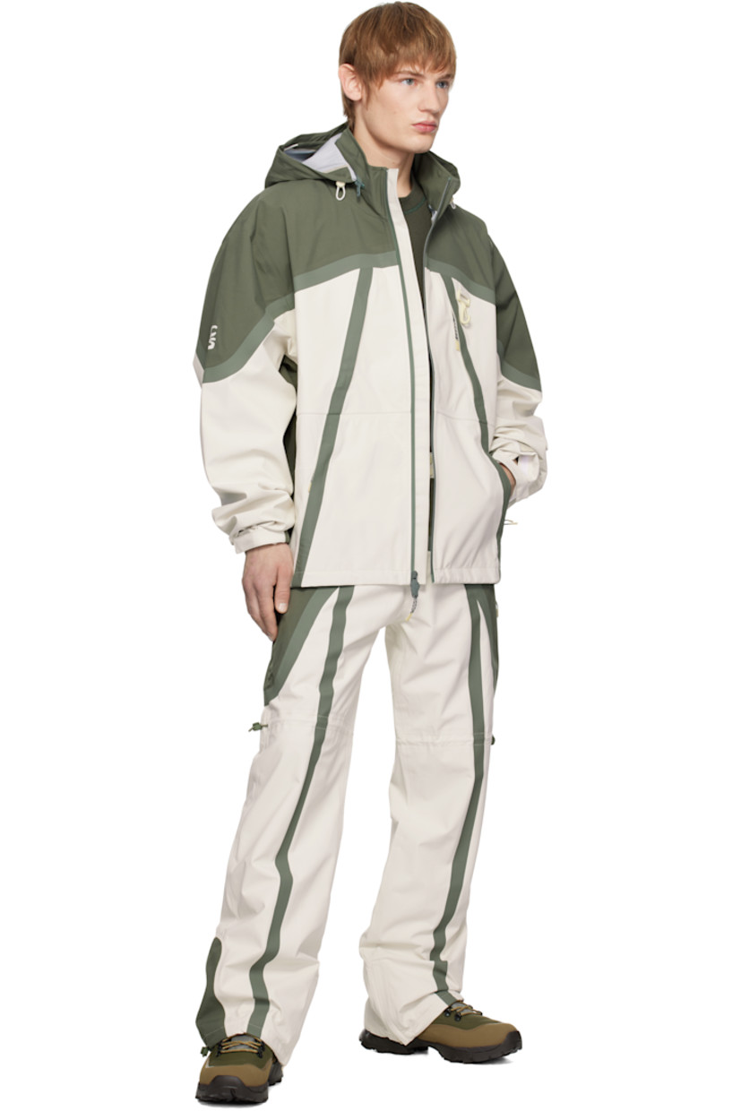 Waterproof 185 gsm recycled polyester taffeta track pants. Taped seams throughout.

· Paneled construction
· Belt loops and concealed velcro tabs at waistband
· Lanyard clasp at front waist
· Four-pocket styling
· Zip-fly
· Bungee-style drawstring at legs and cuffs
· Zip gusset at cuffs
· Full nylon jersey lining

Supplier color: Green/White