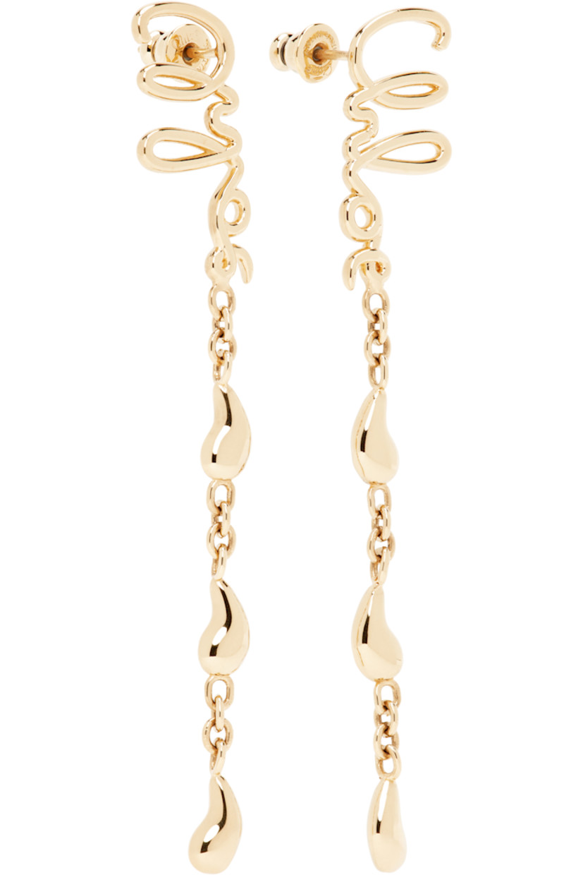 Pair of drop earrings in antiqued gold-tone brass.

· Logo at face
· Charms at drop
· Post-stud fastening
· H3" x W0.5"

Supplier color: Vintage gold