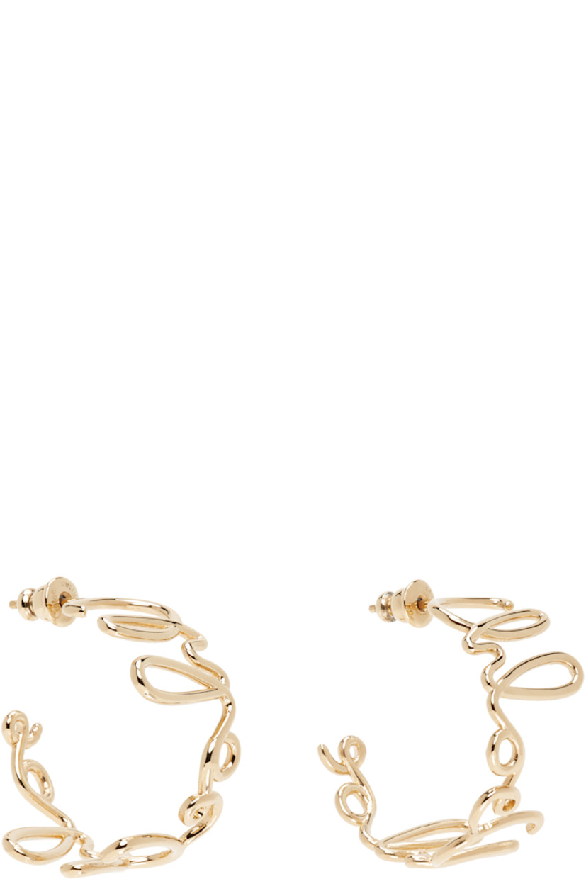 Pair of open hoop earrings in antiqued gold-tone brass.

· Logo throughout
· Post-stud fastening
· H1"

Supplier color: Vintage gold