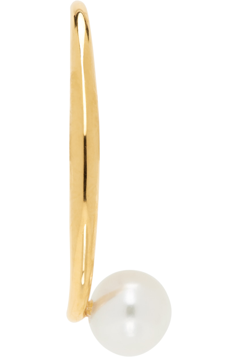 Single handcrafted earring in recycled 18k gold vermeil.

· Freshwater pearl at end
· Post-stud fastening
· H1" x W0.5"

Supplier color: Yellow vermeil