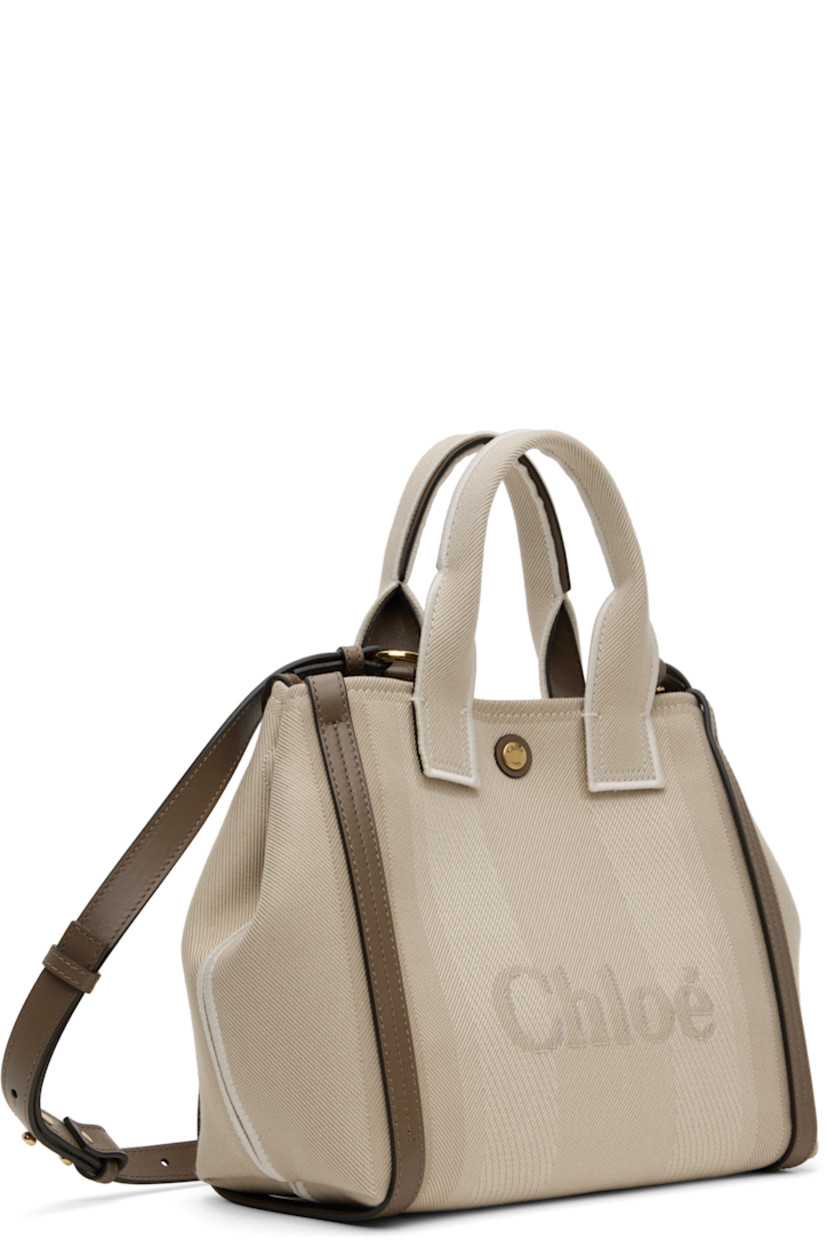 Recycled cotton-blend broken twill tote in beige. LWG-certified buffed calfskin trim throughout.

· Twin rolled carry handles
· Detachable crossbody strap
· Jacquard logo and stripes at face and back face
· Magnetic fastening at sides
· Press-stud closure
· Patch pocket at interior
· Cotton-blend twill lining
· Logo-engraved gold-tone hardware
· H9.5" x W10.5" x D4.5"

Supplier color: Vegetal beige