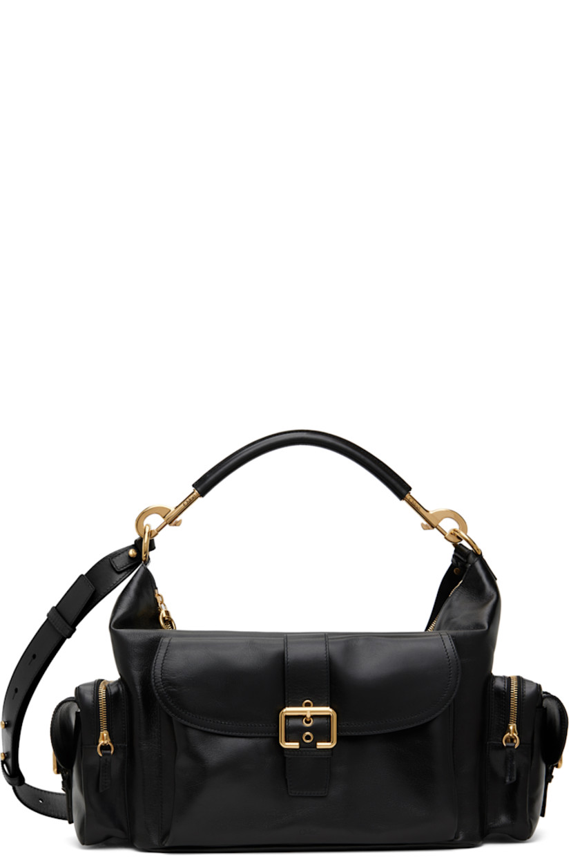 LWG-certified nappa buffalo leather shoulder bag in black.

· Detachable shoulder strap
· Detachable and adjustable post-stud crossbody strap
· Logo embossed at face
· Flap pocket at face
· Zip and flap pocket at sides
· Zip closure
· Patch pocket at interior
· Canvas lining
· Logo-engraved gold-tone hardware
· H9" x W17" x D6"

Supplier color: Black