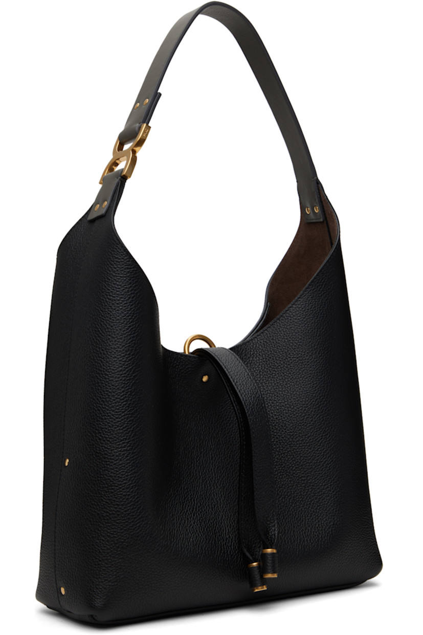 Grained calfskin tote in black.

· Studs throughout
· Logo hardware at fixed shoulder strap
· Logo embossed at face
· Tab-slot closure
· Zip pocket at interior
· Calfskin suede lining
· Logo-engraved gold-tone hardware
· H8" x W10.5" x D3"
· Total height: H18"

Supplier color: Black
