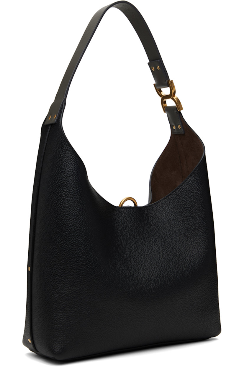 Grained calfskin tote in black.

· Studs throughout
· Logo hardware at fixed shoulder strap
· Logo embossed at face
· Tab-slot closure
· Zip pocket at interior
· Calfskin suede lining
· Logo-engraved gold-tone hardware
· H8" x W10.5" x D3"
· Total height: H18"

Supplier color: Black