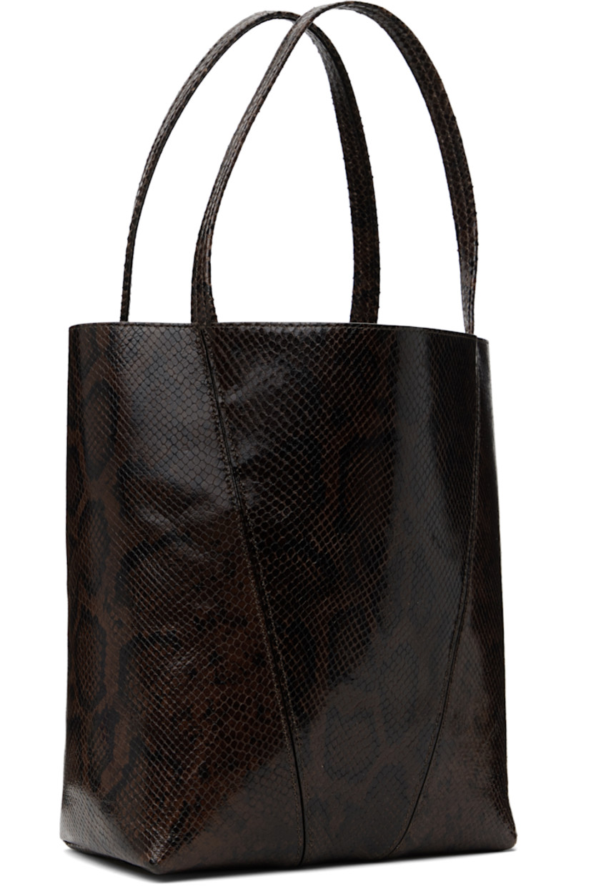Snake-embossed goatskin tote in brown.

· Twin carry handles
· Detachable logo charms at handle 
· Logo stamp at face
· Lanyard clasp at interior
· Calfskin suede lining
· Gold-tone hardware
· H12" x W10.5" x D5.5"

Supplier color: Sooty brown