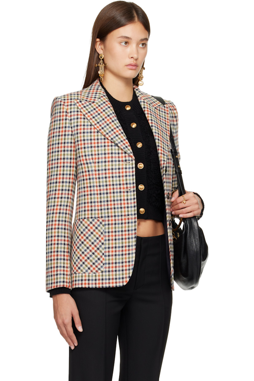 Virgin wool-blend tweed blazer.

· Check pattern throughout
· Peaked lapel
· Button closure
· Patch pockets
· Padded shoulders
· Surgeon's cuffs
· Central vent at back hem
· Full silk satin lining
· Horn hardware

Supplier color: Multicolor