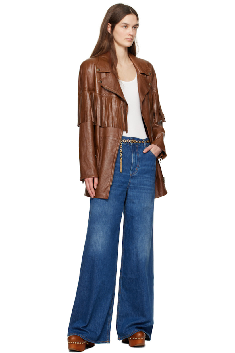 LWG-certified vegetable-tanned grained sheepskin jacket. Fringed trim throughout.

· Press-stud fastenings at notched lapel
· Offset zip closure
· Press-stud belt loops and detachable pin-buckle belt
· Flap pockets 
· Padded shoulders
· Zip vent at cuffs
· Welt pocket at interior
· Full twill lining
· Antiqued gold-tone hardware

Supplier color: Clay brown