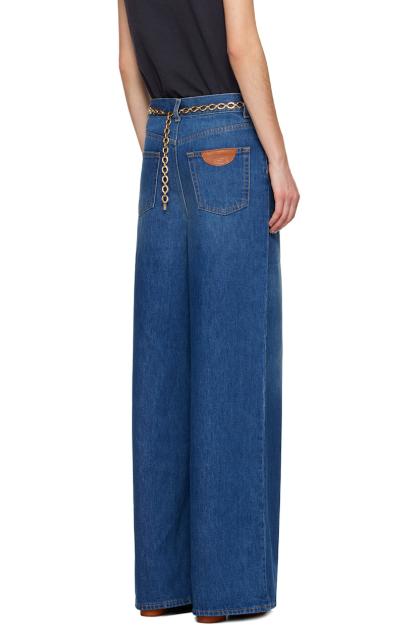 Wide-leg organic cotton non-stretch denim jeans. Fading and whiskering throughout. 

· High-rise
· Belt loops
· Five-pocket styling
· Zip fly
· Leather logo patch at back pocket
· Logo-engraved copper-tone hardware
· Contrast stitching in tan

Supplier color: Night blue