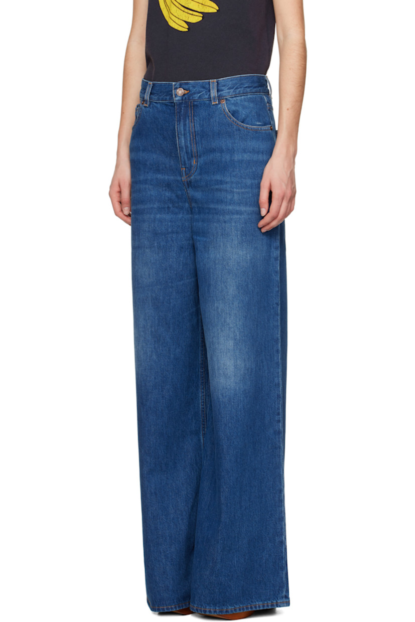 Wide-leg organic cotton non-stretch denim jeans. Fading and whiskering throughout. 

· High-rise
· Belt loops
· Five-pocket styling
· Zip fly
· Leather logo patch at back pocket
· Logo-engraved copper-tone hardware
· Contrast stitching in tan

Supplier color: Night blue