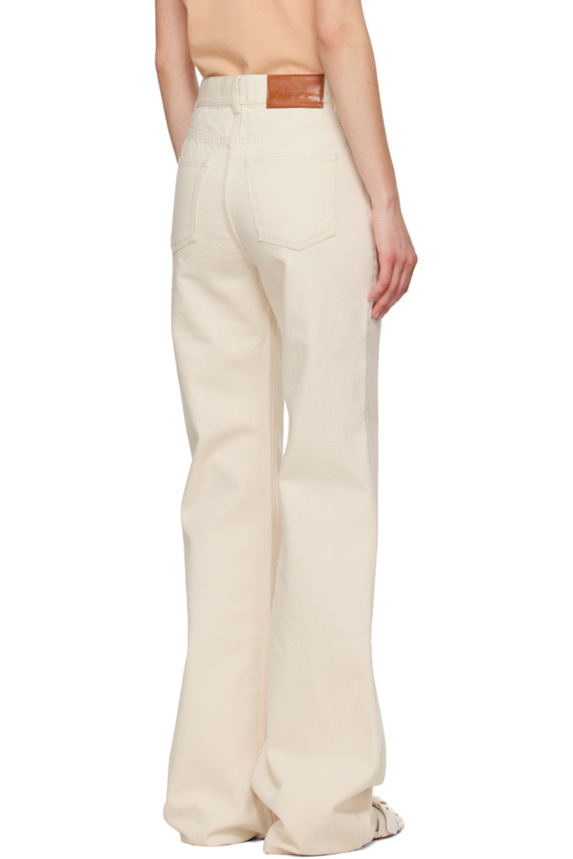 Flared non-stretch organic cotton denim jeans.

· High-rise
· Belt loops
· Five-pocket styling
· Zip fly
· Calfskin logo patch at back waistband
· Logo-engraved antiqued copper-tone hardware

Supplier color: Eden white