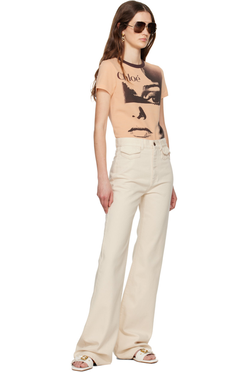 Flared non-stretch organic cotton denim jeans.

· High-rise
· Belt loops
· Five-pocket styling
· Zip fly
· Calfskin logo patch at back waistband
· Logo-engraved antiqued copper-tone hardware

Supplier color: Eden white
