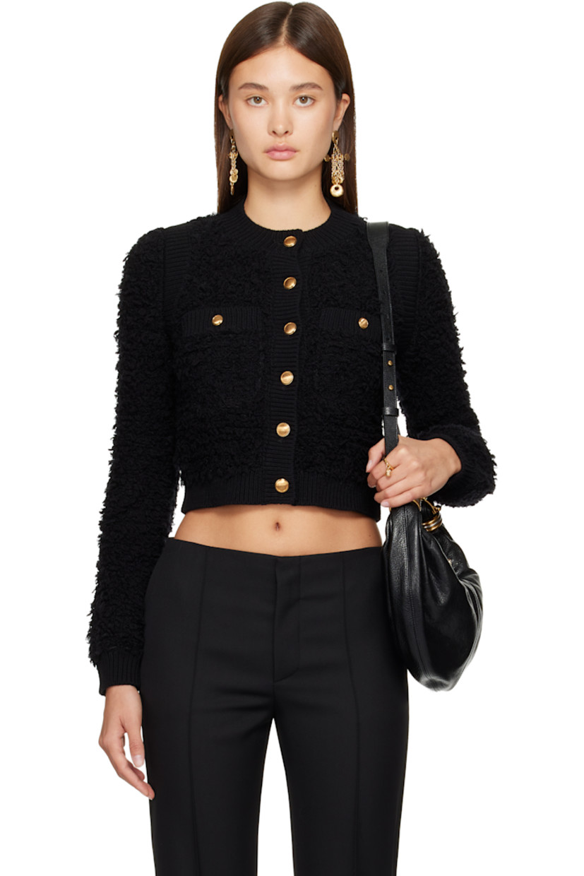 Knit mohair- and wool-blend bouclé cardigan.

· Rib-knit crewneck, hem, armscyes, and cuffs
· Button closure
· Welt pockets at front
· Cropped hem

Supplier color: Black