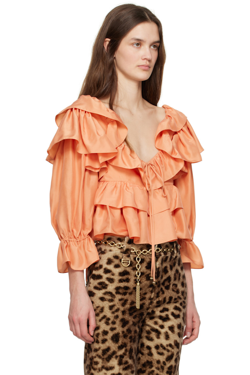 Silk poplin blouse. Ruffles throughout. 

· Self-tie fastening at scoop neck
· Three-button closure
· Tiered cropped hem
· Self-tie drawstring at flared cuffs
· Partially lined

Supplier color: Shell coral