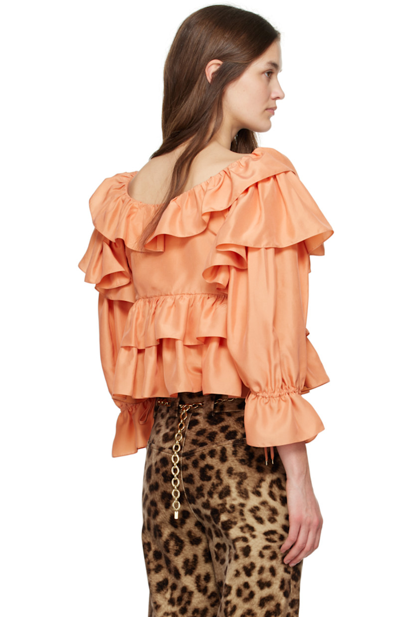 Silk poplin blouse. Ruffles throughout. 

· Self-tie fastening at scoop neck
· Three-button closure
· Tiered cropped hem
· Self-tie drawstring at flared cuffs
· Partially lined

Supplier color: Shell coral