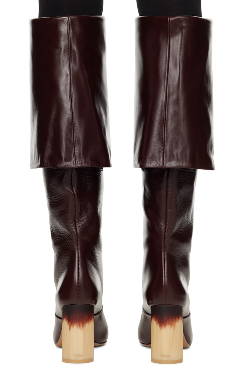 Knee-high LWG-certified grained calfskin boots in burgundy. 

· Square toe
· Foldover collar
· Buffed lambskin lining 
· Block heel with rubber injection
· Leather sole
· Heel: H3.5"

Supplier color: Stormy red