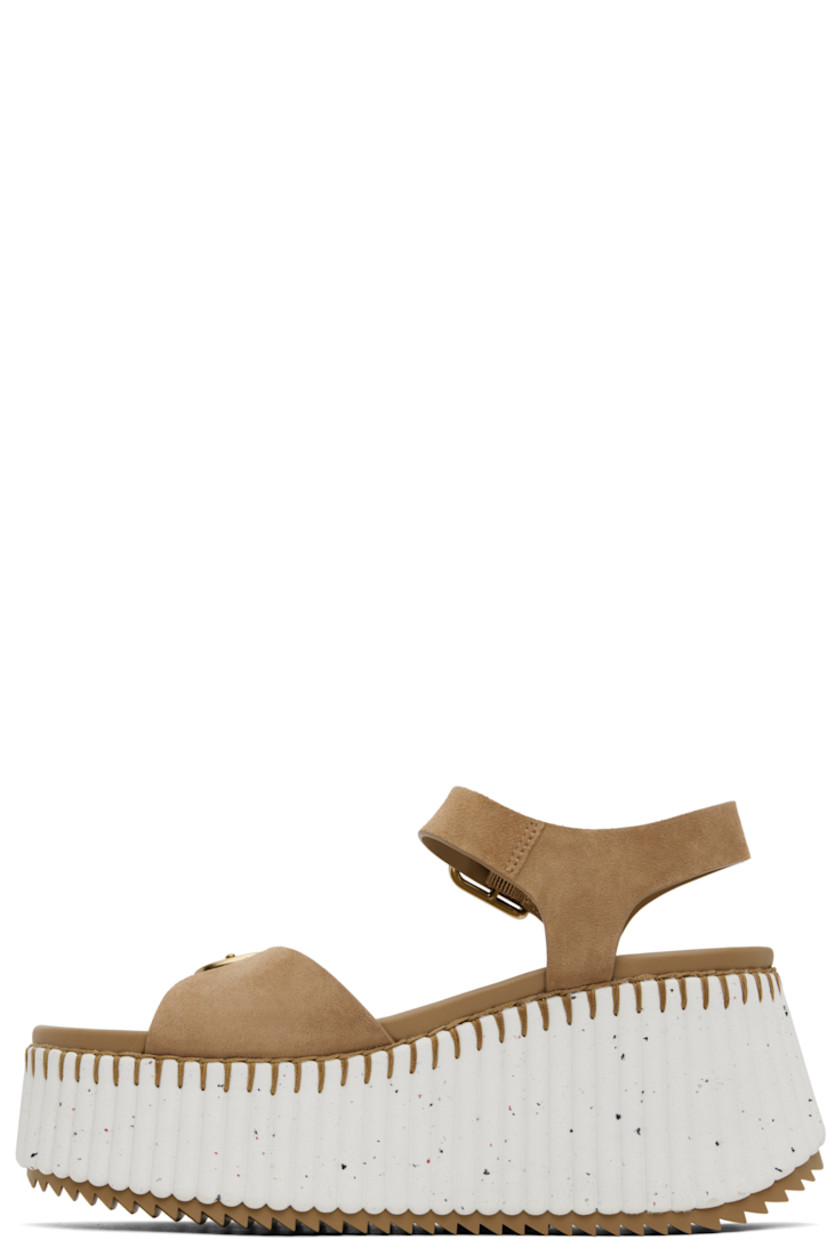Suede sandals in brown.

· Open toe
· Pin-buckle strap at vamp
· Pin-buckle slingback strap
· Logo-embossed buffed leather footbed
· Textured platform midsole
· Treaded rubber sole
· Platform: H2.25"
· Heel: H3.5"

Supplier color: Dune brown