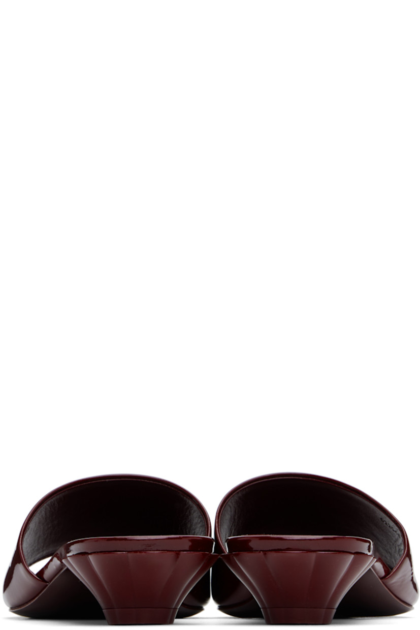 Patent calfskin slip-on flat sandals in burgundy.

· LWG-certified
· Open square toe
· Logo embossed at vamp
· Logo embossed at goatskin footbed
· Sculptural kitten heel with rubber injection
· Polished leather sole
· Heel: H1.5"

Supplier color: Obscure red