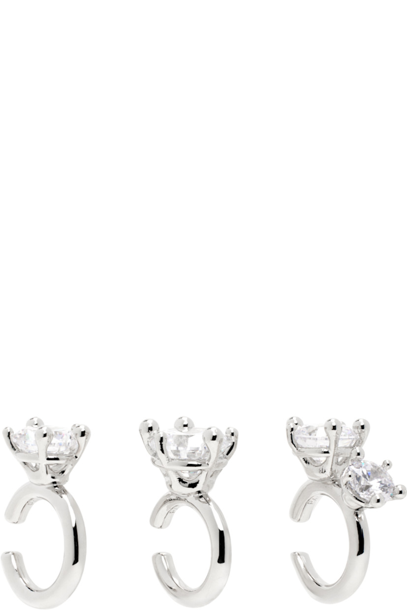Set of three ear cuffs in rhodium-plated brass. 

· Prong-set cubic zirconia stones 
· D0.5"

Supplier color: Brass/Silver