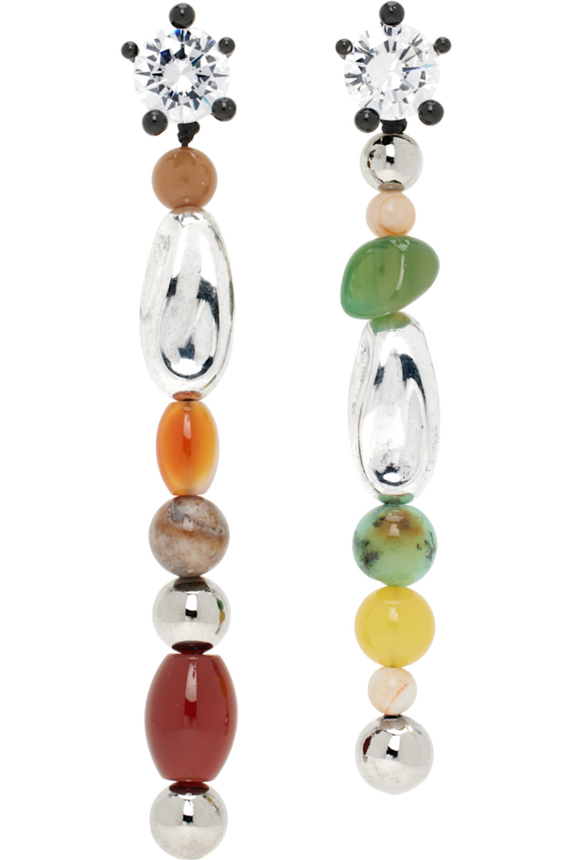 Pair of mismatched drop earrings in rhodium-plated brass.

· Prong-set cubic zirconia stone at face
· Black enamel and resin beads
· Agate, carnelian, and fluorite stones at drop
· Post-stud fastening 
· H4" x W0.5"; H3.75" x W0.5"

Supplier color: Brass/Multi