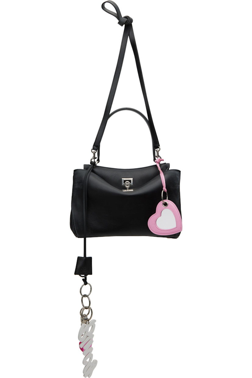 Smooth calfskin top handle bag in black. Detachable sheathed keyring, logo-engraved key charms, graphic charms, and mirror at strap.

· Fading and distressing throughout
· Fixed shoulder strap
· Detachable crossbody strap
· Press-stud fastenings at sides
· Patch pockets at back face
· Bumper studs at base
· Turn-lock closure
· Zip pocket at two-compartment interior
· Nappa lambskin lining
· Logo-engraved antiqued silver-tone hardware
· H8" x W10.5" x D4"

Supplier color: Black