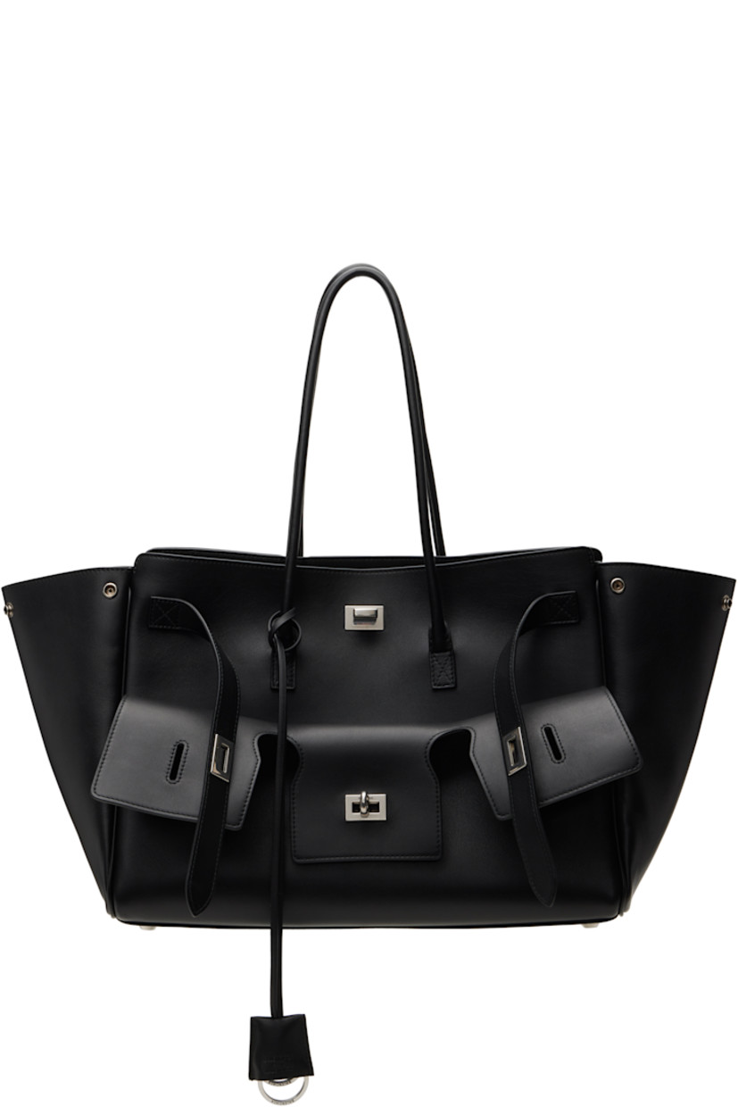 Buffed calfskin top handle bag in black.

· Rolled shoulder straps
· Detachable sheathed keyrings at strap base
· Fold-down pocket with turn-lock straps at face
· Press-stud fastenings at sides
· Silver-tone logo stamp at back face
· Bumper studs at base
· Open throat
· Zip and patch pockets at interior
· Bonded nappa lambskin lining
· Logo-engraved antiqued silver-tone hardware
· H11" x W14.5" x D6.75"

Supplier color: Black