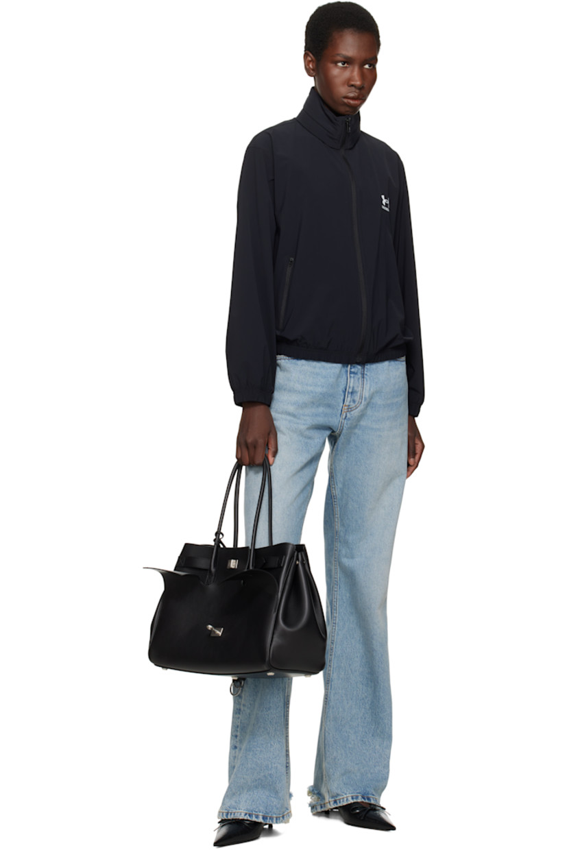 Buffed calfskin top handle bag in black.

· Rolled shoulder straps
· Detachable sheathed keyrings at strap base
· Fold-down pocket with turn-lock straps at face
· Press-stud fastenings at sides
· Silver-tone logo stamp at back face
· Bumper studs at base
· Open throat
· Zip and patch pockets at interior
· Bonded nappa lambskin lining
· Logo-engraved antiqued silver-tone hardware
· H11" x W14.5" x D6.75"

Supplier color: Black