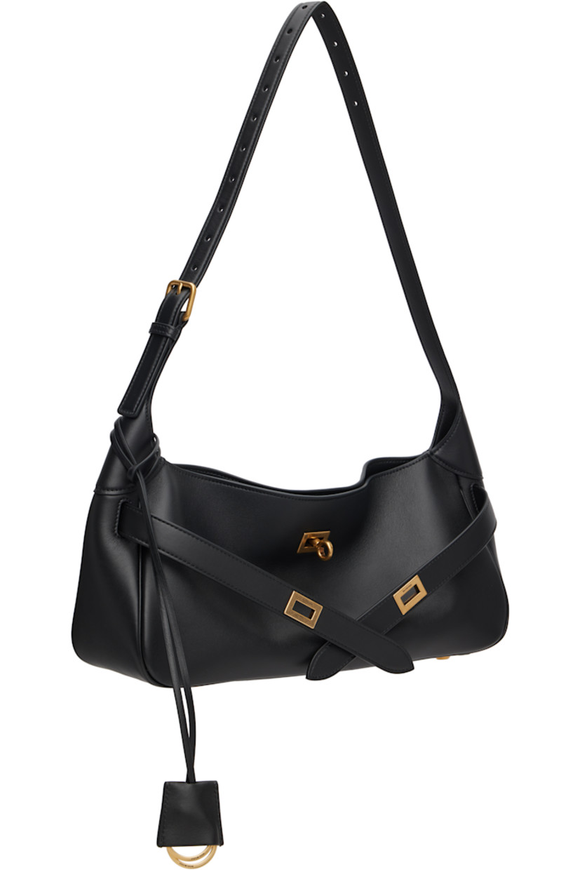 Buffed calfskin shoulder bag.

· Adjustable shoulder strap
· Detachable logo-embossed sheathed keyrings
· Straps with cutout at face
· Rivets and logo plaque at back face
· Bumper studs at base 
· Turn-lock closure 
· Zip pocket at interior 
· Bonded nappa lambskin lining
· Logo-engraved antiqued gold-tone hardware
· H6.5" x W14" x D4.5"

Supplier color: Black