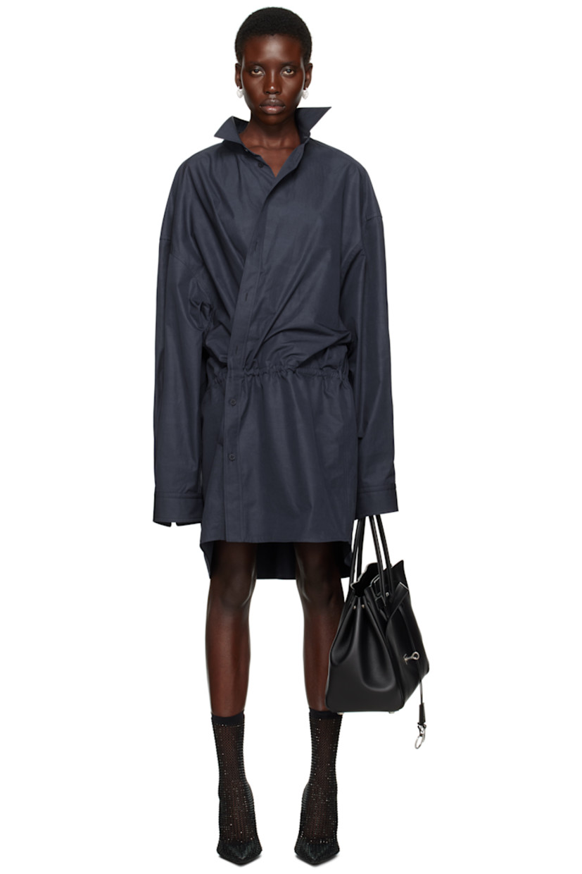 Washed cotton poplin minidress. 

· Spread collar
· Offset button closure
· Drawstring at waist
· Dropped shoulders
· Pleat at buttoned barrel cuffs

Supplier color: Faded blue