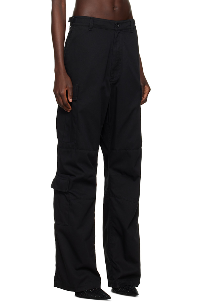 Polyester- and cotton-blend twill cargo pants. 

· Mid-rise 
· Belt loops
· Cinch tabs at waistband
· Four-pocket styling
· Zip fly
· Darts at knees
· Cargo pockets at outseams

Supplier color: Black