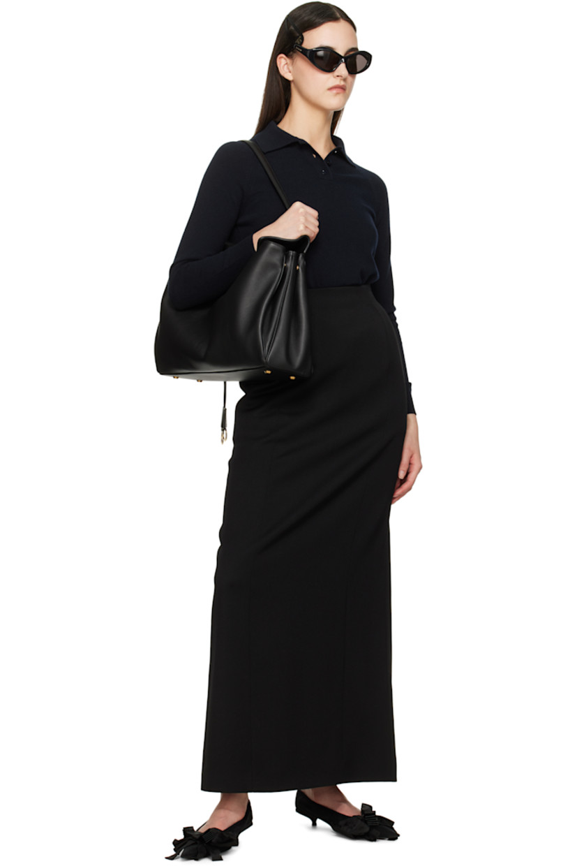 Wool gabardine maxi skirt.

· Quilted silk-blend padding at side seams
· Zip closure at back waistband
· Vent at back hem
· Full logo-woven satin lining

Supplier color: Black