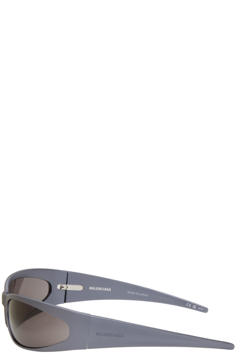 Wraparound rectangular aluminum-frame sunglasses in gunmetal tone.

· Mirrored gray lenses
· 100% UVA/UVB protection, Category 3
· Integrated nose pads
· Logo engraved at temple
· Includes case
· Size: 77.20 115

Supplier color: Grey/Grey/Grey