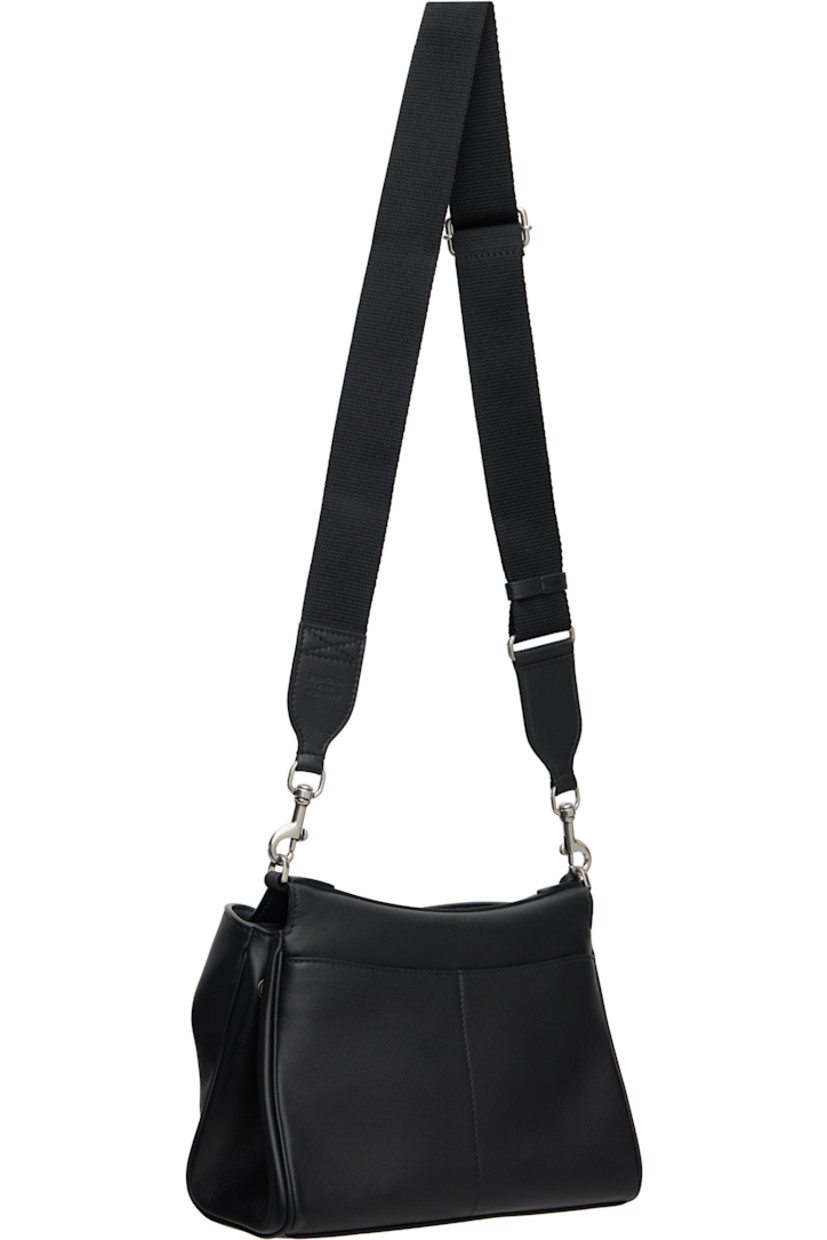Buffed calfskin messenger bag. 

· Detachable leather crossbody strap
· Adjustable and detachable webbing crossbody strap
· Detachable logo-embossed sheathed keyrings
· Patch pockets at back face 
· Press-stud accordion panel at sides
· Patch pockets at back face
· Bumper studs at base
· Turn-lock flap 
· Zip pocket at two-compartment interior 
· Bonded nappa lambskin lining
· Logo-engraved antiqued silver-tone hardware
· H7" x W9.5" x D4"

Supplier color: Black