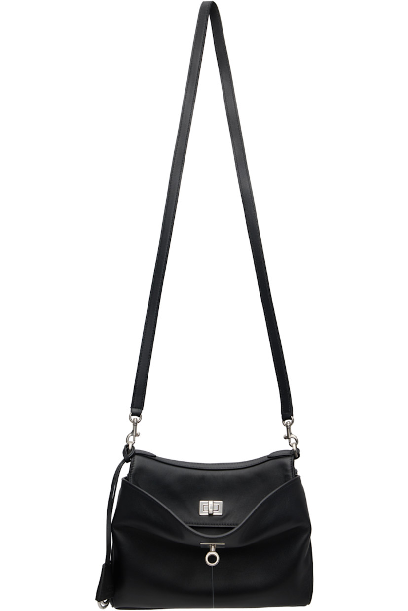 Buffed calfskin messenger bag. 

· Detachable leather crossbody strap
· Adjustable and detachable webbing crossbody strap
· Detachable logo-embossed sheathed keyrings
· Patch pockets at back face 
· Press-stud accordion panel at sides
· Patch pockets at back face
· Bumper studs at base
· Turn-lock flap 
· Zip pocket at two-compartment interior 
· Bonded nappa lambskin lining
· Logo-engraved antiqued silver-tone hardware
· H7" x W9.5" x D4"

Supplier color: Black