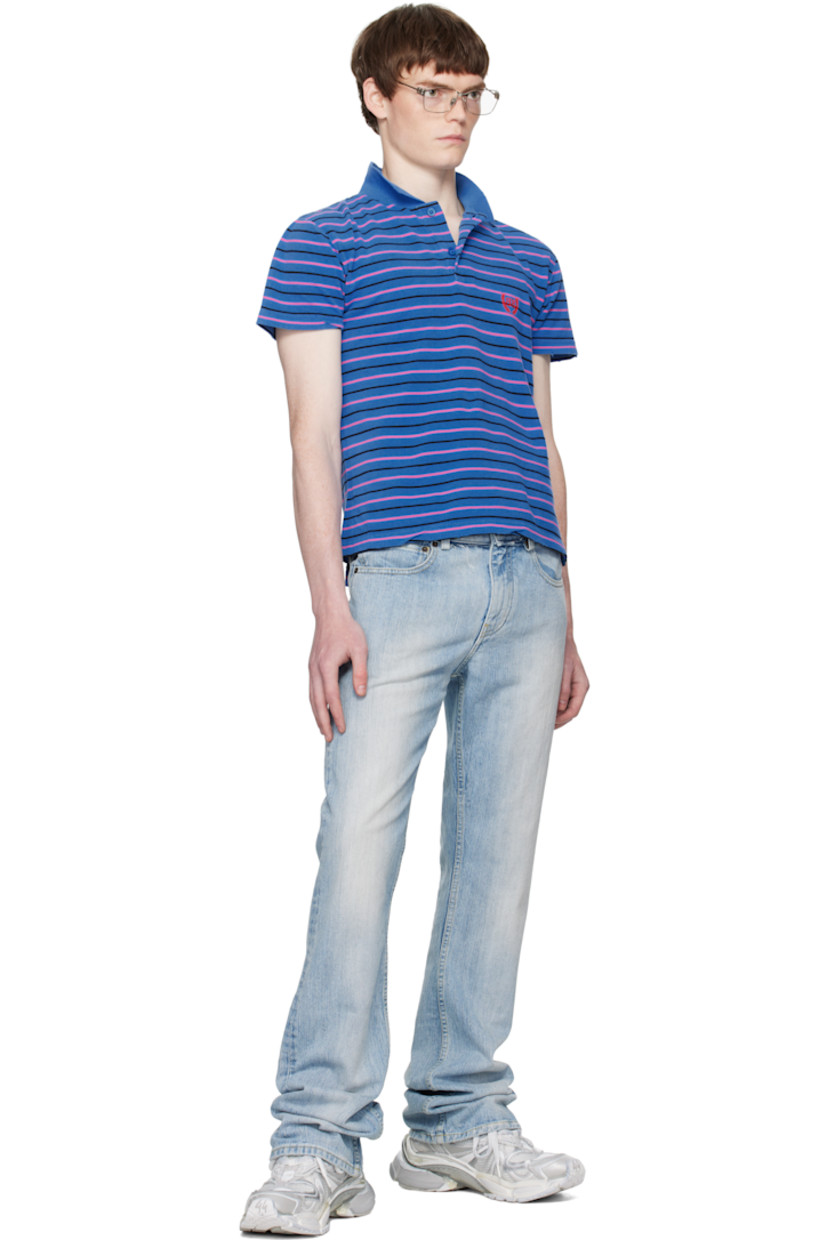 Cotton piqué polo.

· Distressing and stripes throughout
· Rib-knit spread collar
· Two-button placket
· Logo embroidered at chest
· Tennis-tail hem

Supplier color: Blue/Pink/Black