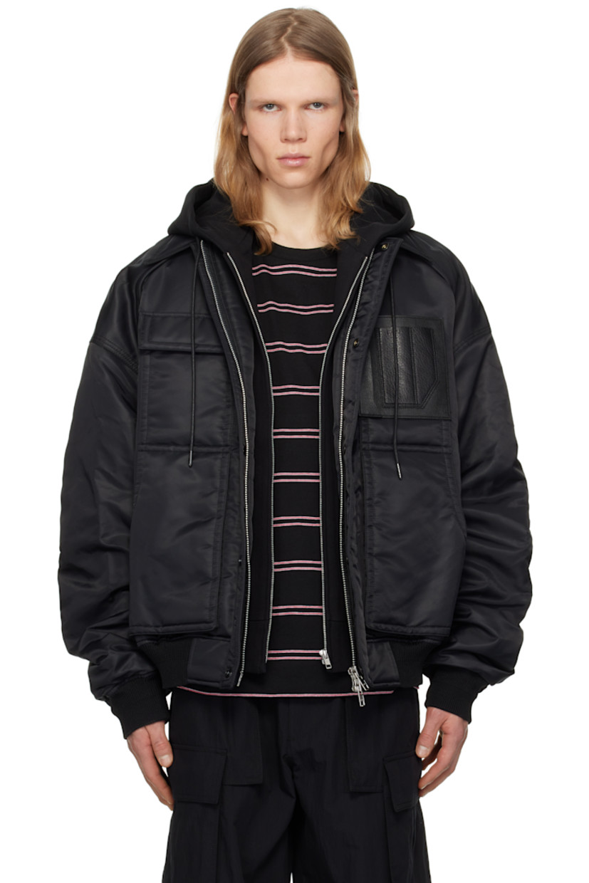 Padded nylon taffeta bomber jacket.

· Drawstring at detachable hood
· Spread collar
· Two-way zip closure with press-stud placket
· Flap pocket and patch pockets
· Pen slots and embossed logo at chest
· Rib-knit hem and cuffs
· Dropped shoulders
· Welt pocket at interior
· Full satin lining

Supplier color: Black