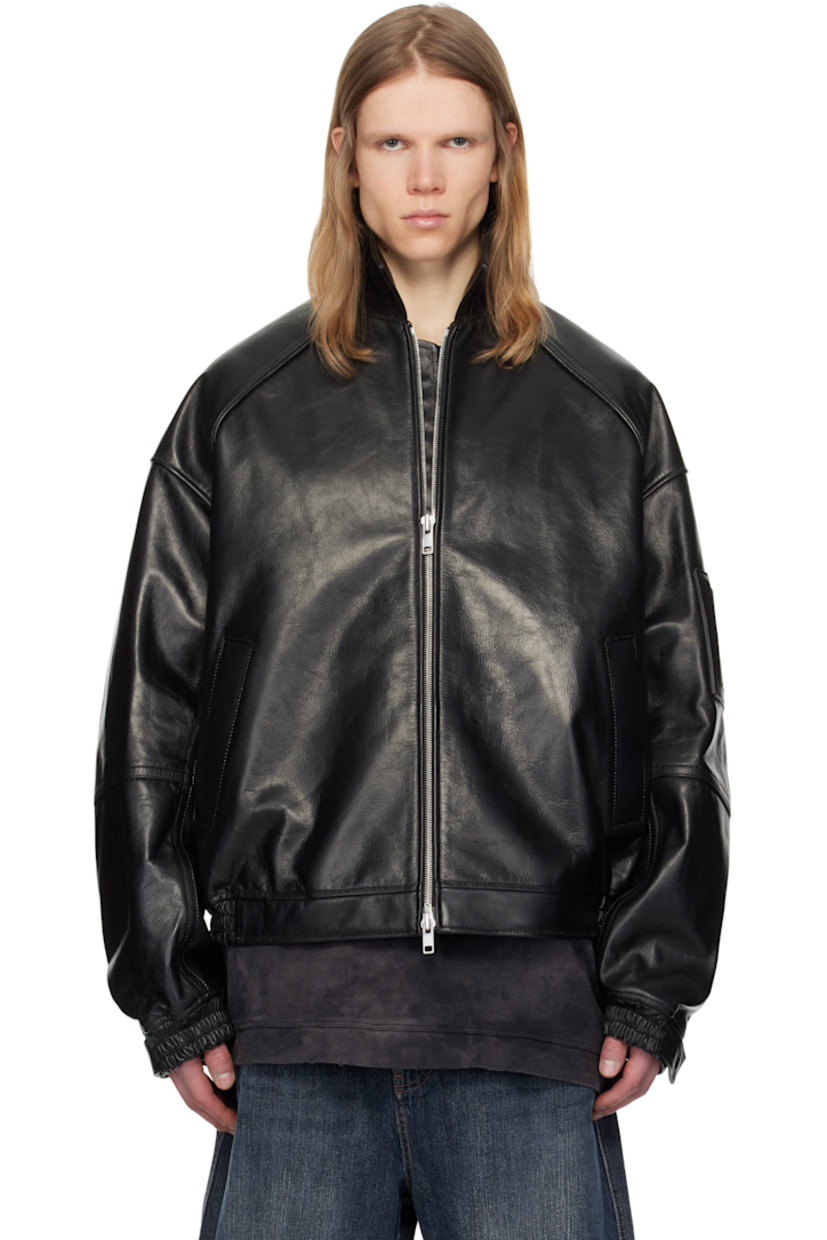 Padded grained leather bomber jacket.

· Spread collar
· Two-way zip closure
· Welt pockets
· Partially elasticized hem
· Raglan sleeves
· Adjustable press-stud tab at elasticized cuffs
· Welt pocket at interior
· Full satin lining

Supplier color: Black