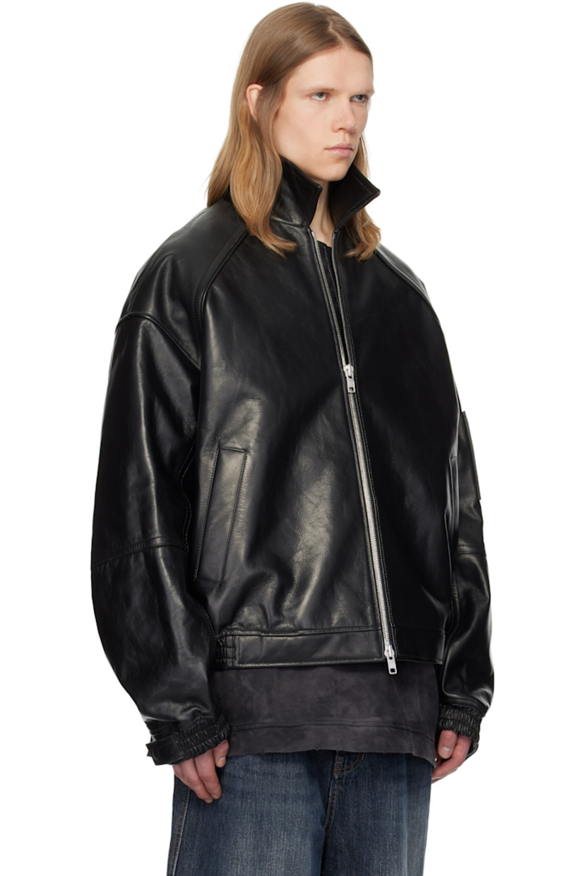 Padded grained leather bomber jacket.

· Spread collar
· Two-way zip closure
· Welt pockets
· Partially elasticized hem
· Raglan sleeves
· Adjustable press-stud tab at elasticized cuffs
· Welt pocket at interior
· Full satin lining

Supplier color: Black