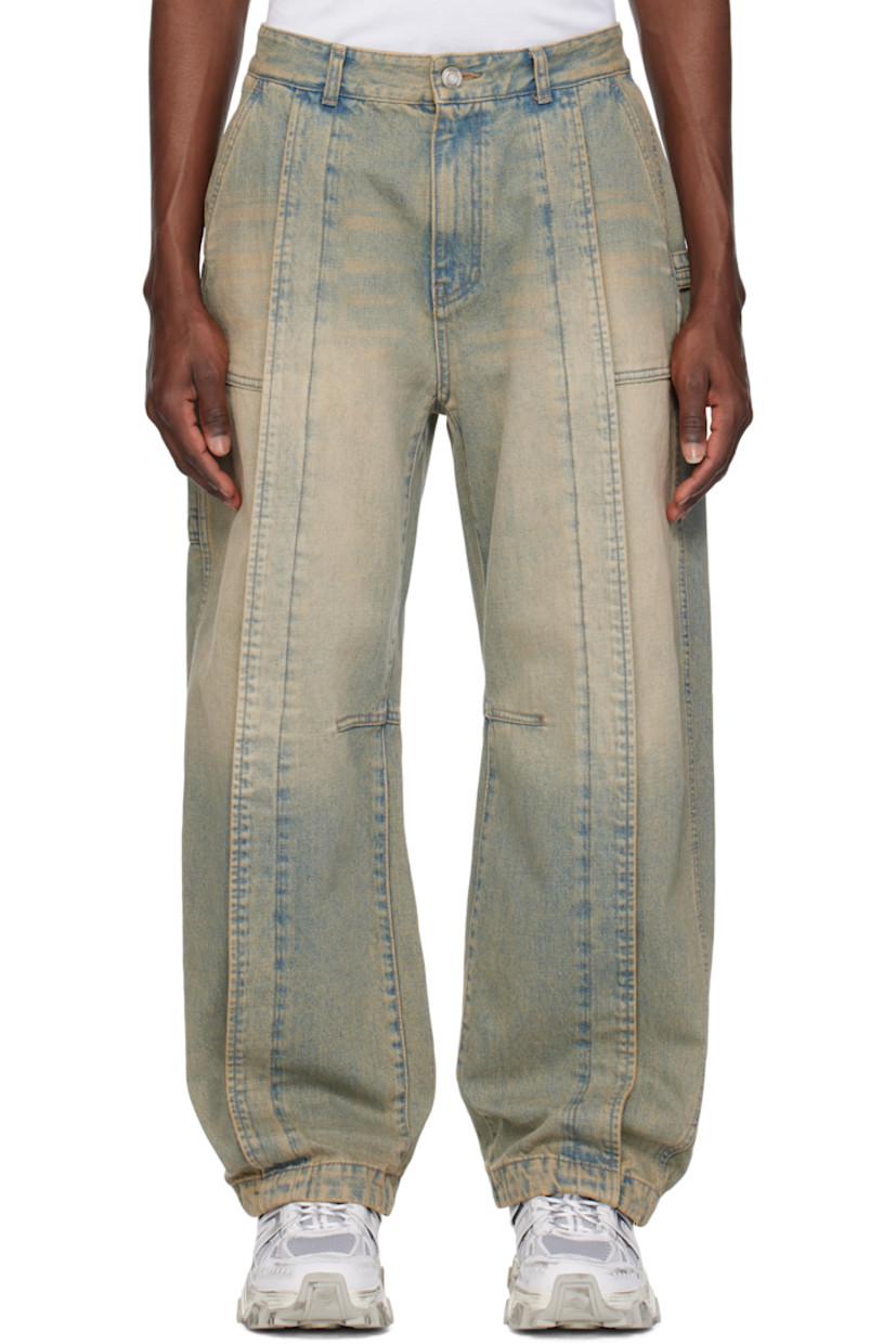 Non-stretch denim jeans. Fading, whiskering, and subtle distressing throughout.

· Belt loops
· Four-pocket styling
· Zip fly
· Pleat at front legs
· Dart at inseams
· Curved outseams
· Hammer loop at back pocket
· Logo hardware at back pocket
· Patch pockets at back leg
· Logo-engraved silver-tone hardware

Supplier color: Blue