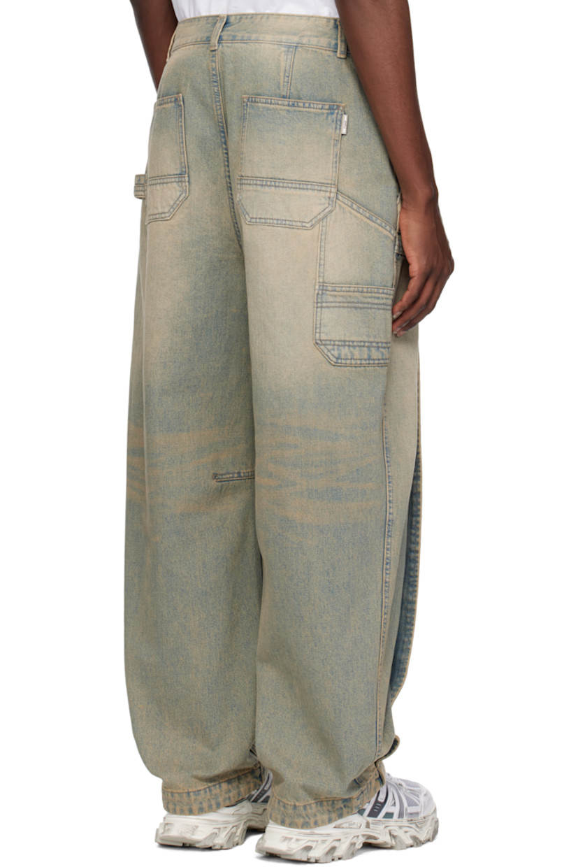 Non-stretch denim jeans. Fading, whiskering, and subtle distressing throughout.

· Belt loops
· Four-pocket styling
· Zip fly
· Pleat at front legs
· Dart at inseams
· Curved outseams
· Hammer loop at back pocket
· Logo hardware at back pocket
· Patch pockets at back leg
· Logo-engraved silver-tone hardware

Supplier color: Blue