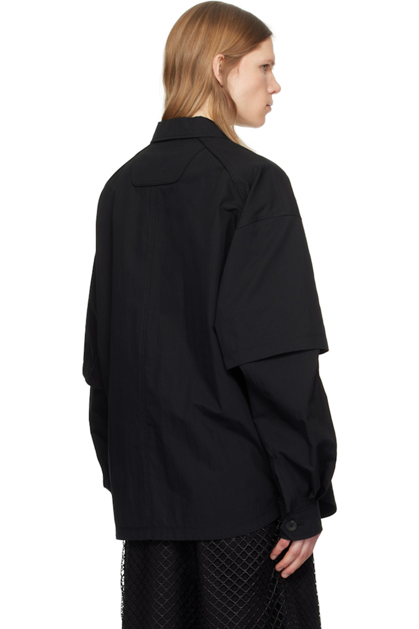 Cotton- and nylon-blend canvas shirt.

· Layered construction
· Spread collar
· Button closure
· Patch and flap pockets
· Shirttail hem
· Dropped shoulders
· Detachable sleeves for alternate styling
· Pleated single-button cuffs

Supplier color: Black
