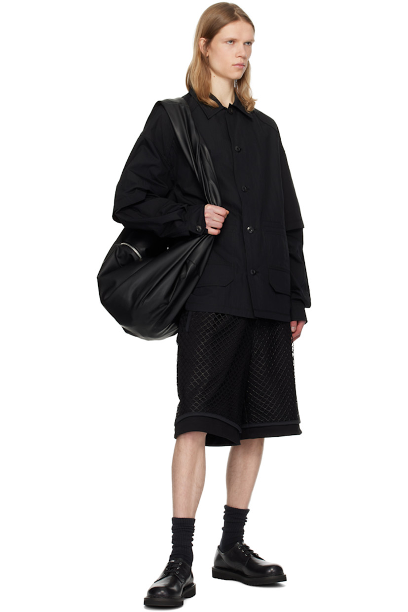 Cotton- and nylon-blend canvas shirt.

· Layered construction
· Spread collar
· Button closure
· Patch and flap pockets
· Shirttail hem
· Dropped shoulders
· Detachable sleeves for alternate styling
· Pleated single-button cuffs

Supplier color: Black