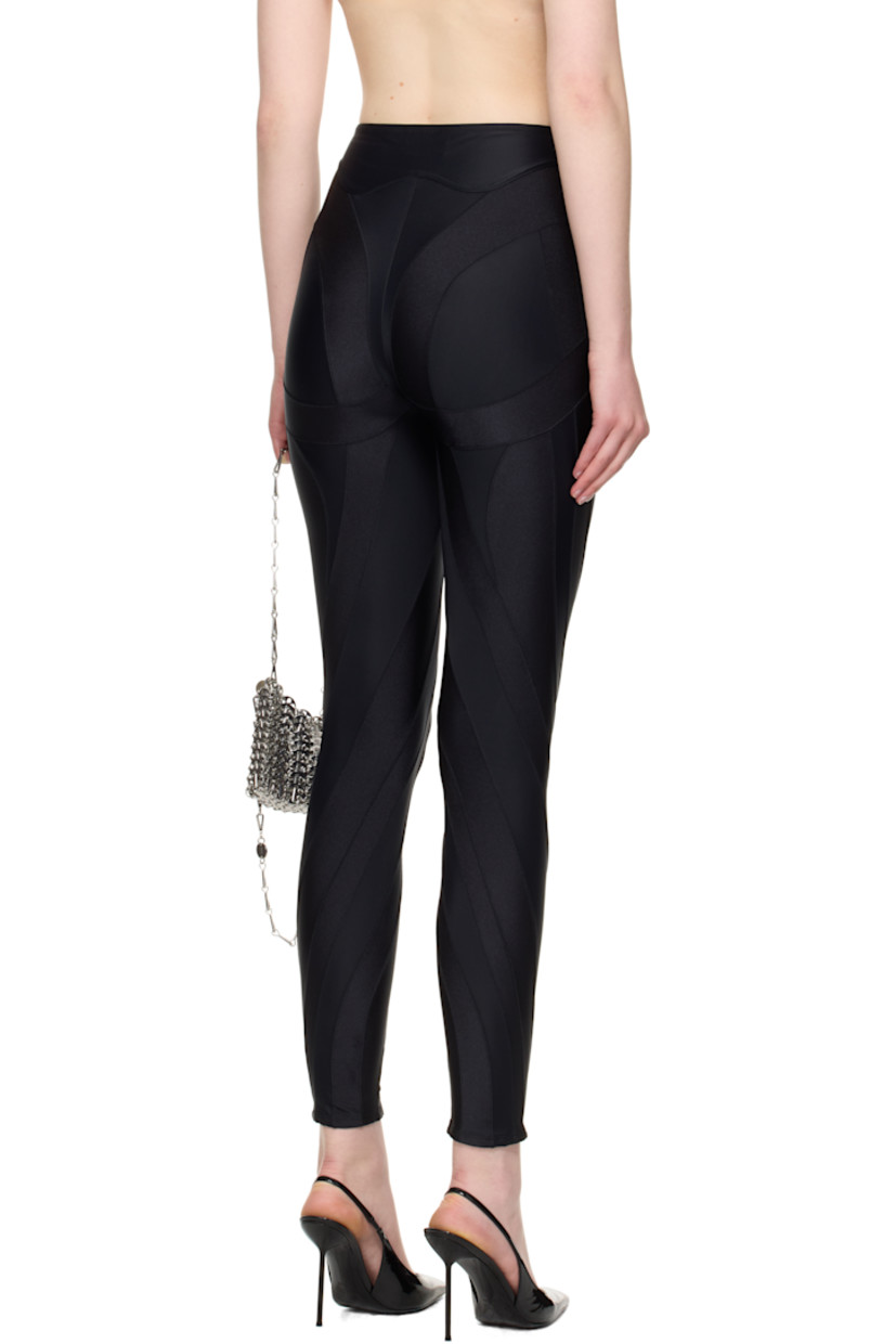 Stretch recycled nylon jersey leggings.

· Paneled construction
· Elasticized waistband
· Logo bonded at outseam

Supplier color: Black