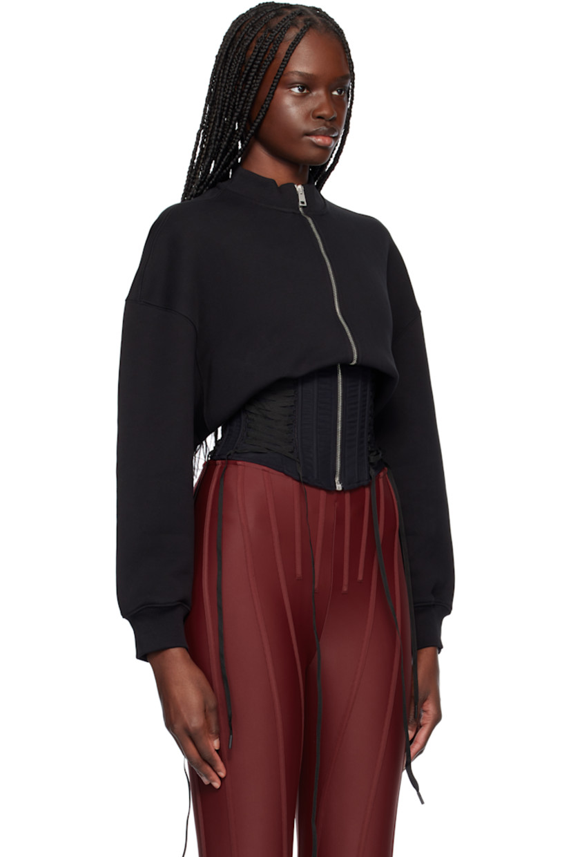 Organic cotton fleece and mesh track jacket.

· Paneled construction
· Rib-knit crewneck and cuffs
· Zip closure
· Boning and lace-up detailing at corset-style hem
· Dropped shoulders
· Logo-plaque at back collar
· Twin pleats at back

Supplier color: Black
